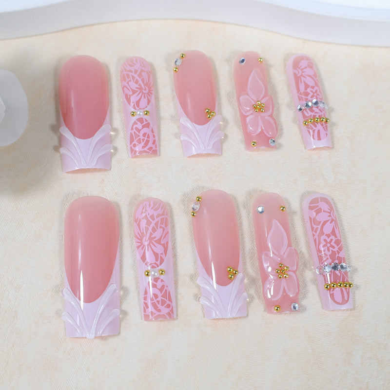 Artificial nail set with floral designs and sparkling accents Stornfield