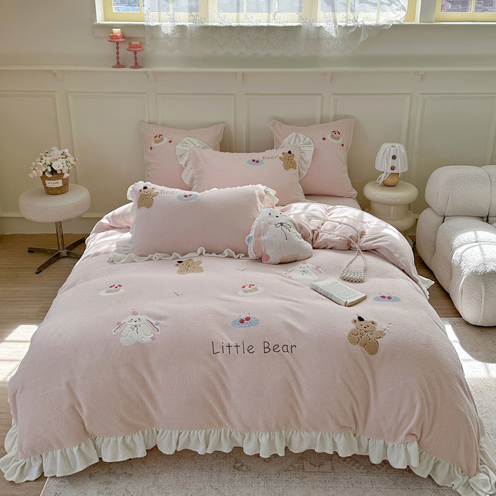 Bedding set with plush surface, ruffled hem and cute embroidery designs