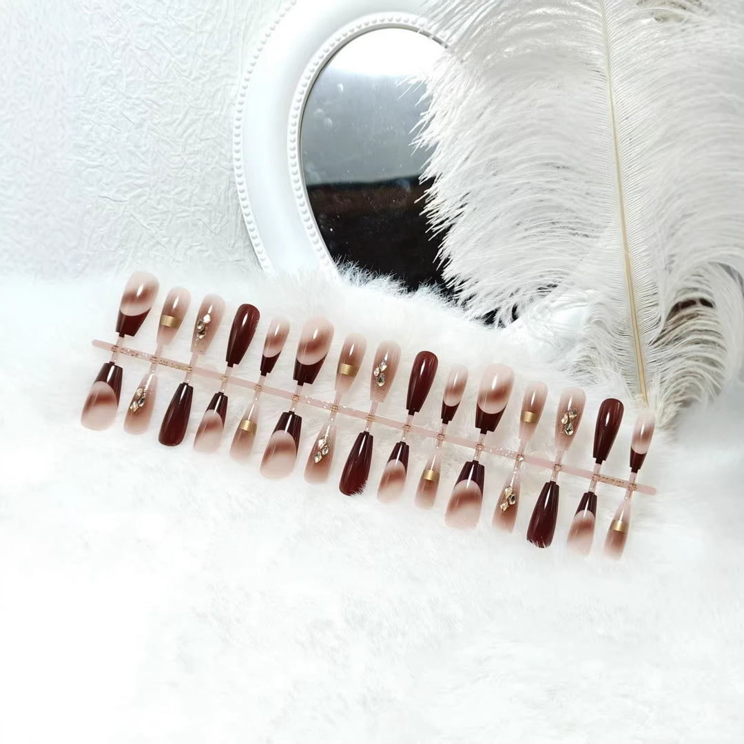 Artificial nails with elegant color gradients and jewelry details Stornfield