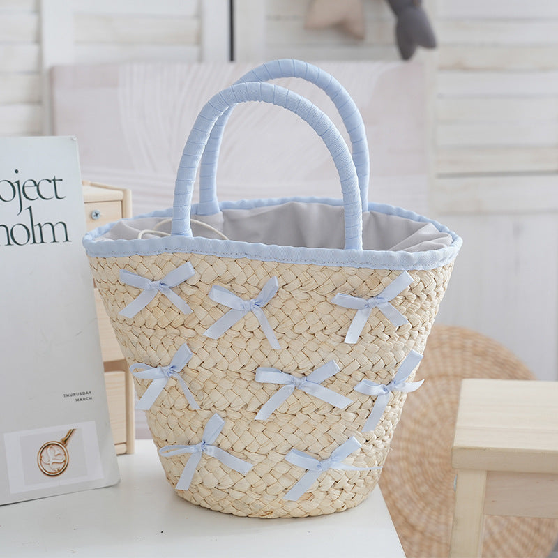 Basket bag with delicate bows and padded edge Stornfield