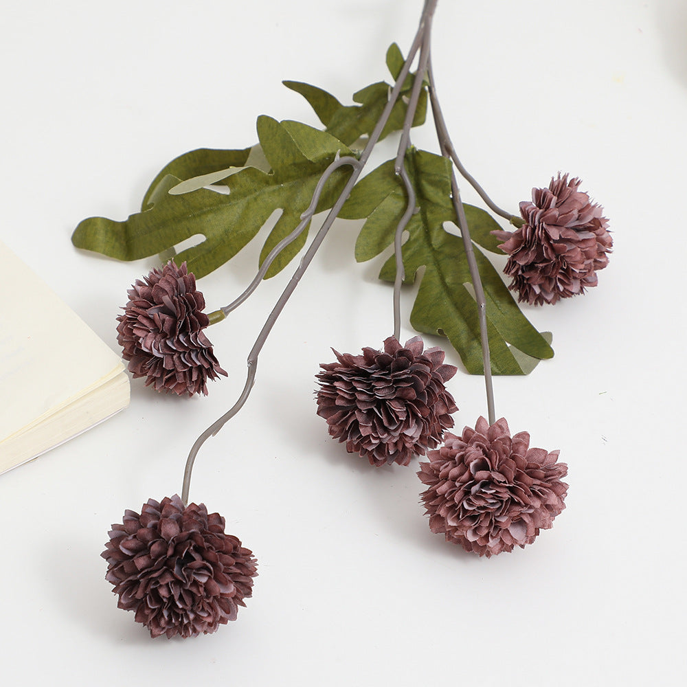 Artificial flower branch with intricate flowers