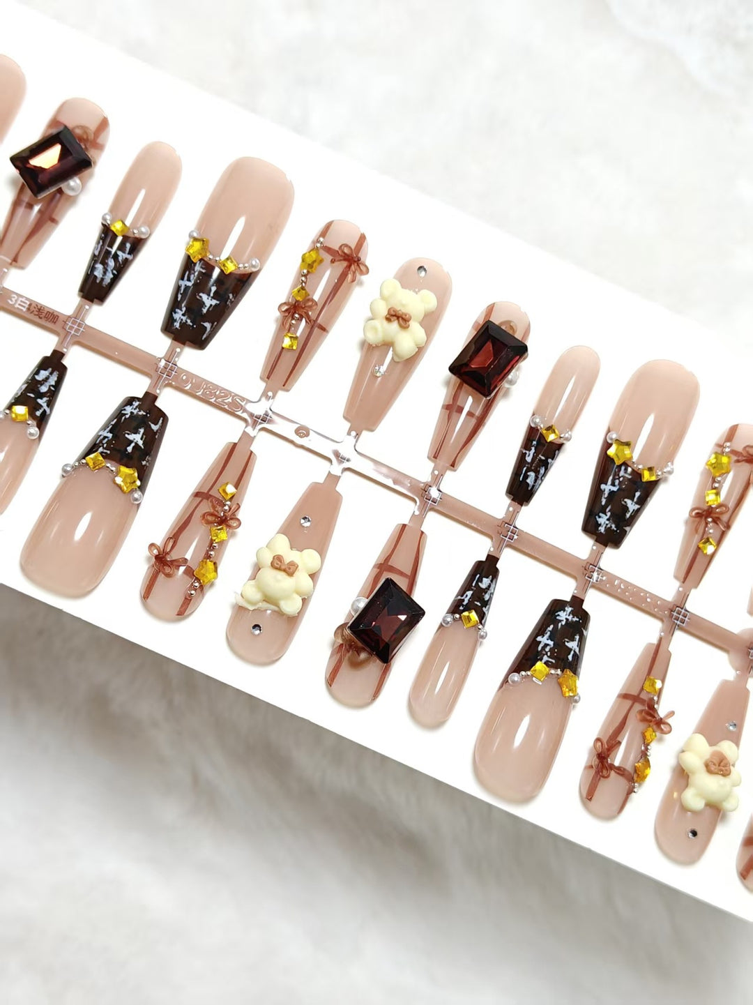 Artificial nails with living bear and gemstone accent Stornfield