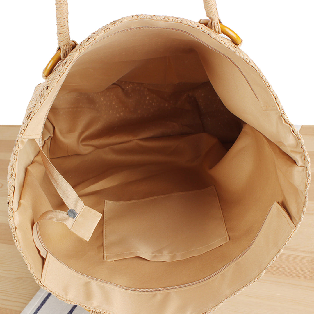 Beach bag made of natural woven material with sturdy carry handles Stornfield