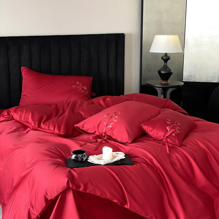 Premium cotton satin bedding set with botanical embroidery and decorative cushion ties