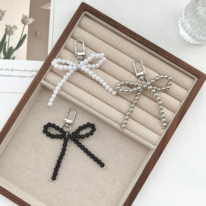 Elegant Pearl Bow Keychain Stornfield