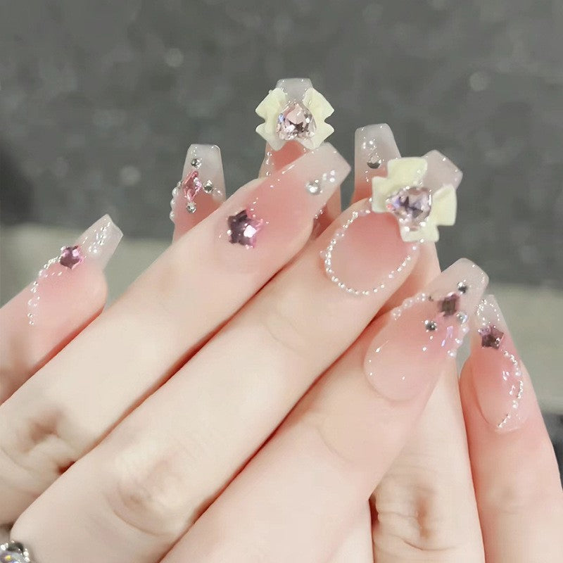 Glamorous artificial fingernails with glitter and moon designs Stornfield