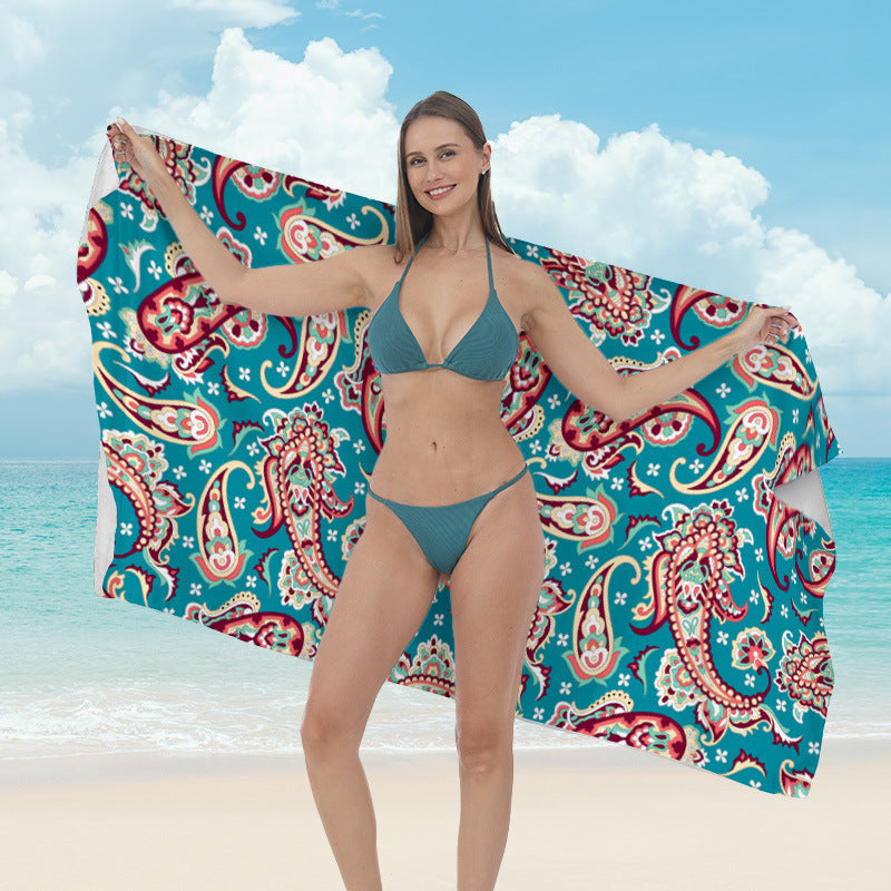 Beach towel with vibrant tropical plant motif Stornfield