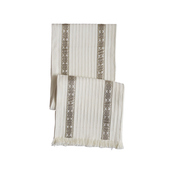 Woven table runner with contrasting center stripe, textured waffle look and decorative fringes