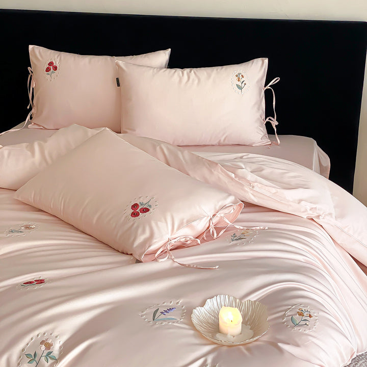 Luxurious cotton satin bedding set with delicate floral embroidery and ties