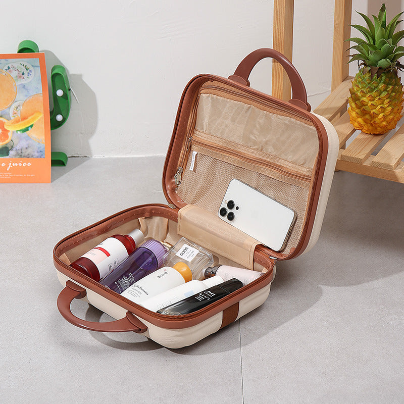 compact hardshell vanity travel case with molded ribbed exterior cushioned organizer panels and dual-lock zipper Stornfield