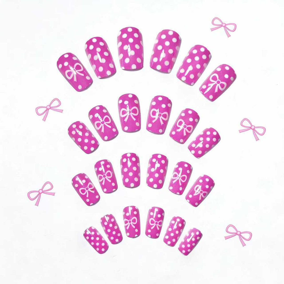 Artificial nails with romantic polka dot pattern and bow Stornfield