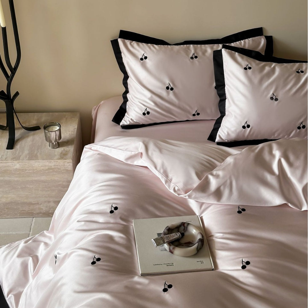 Elegant satin bed set with fine cherry embroidery and contrasting piping