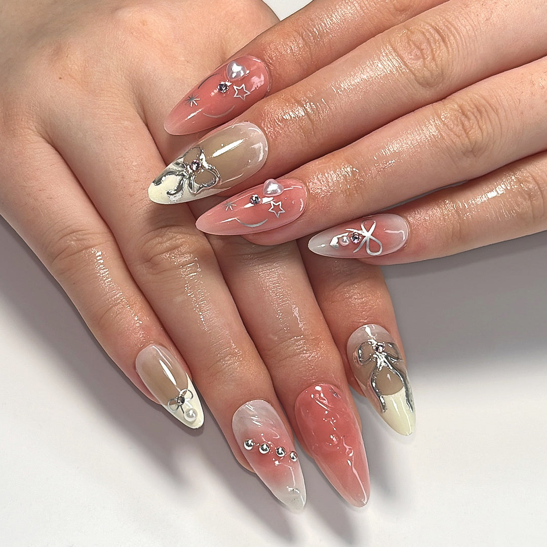 Artistic Nail Tips with Glitter and Bow Motifs Stornfield