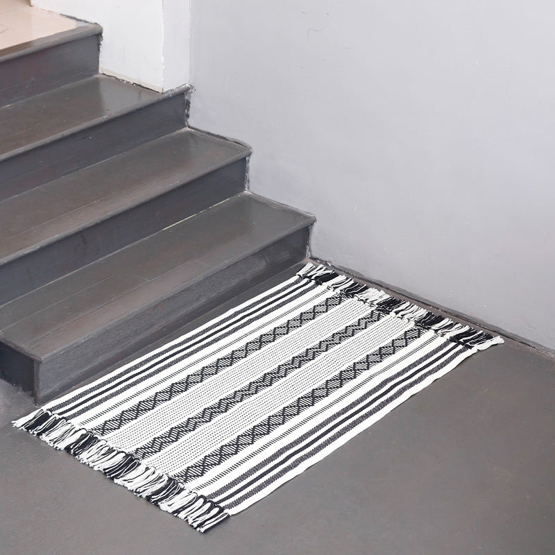 Flat-woven cotton runner with fringes and graphic ethnic stripe pattern Stornfield
