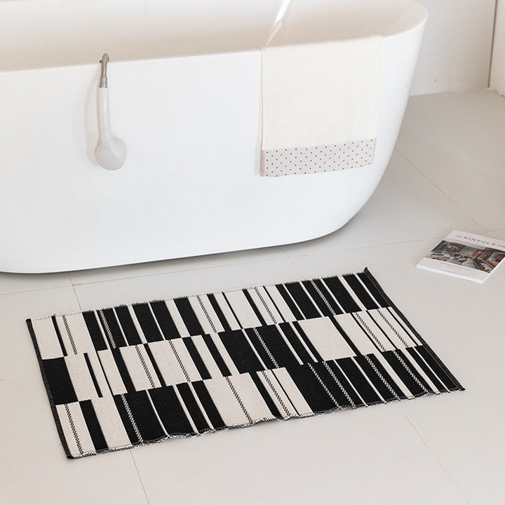 Flat-woven bath mat with abstract geometric pattern Stornfield