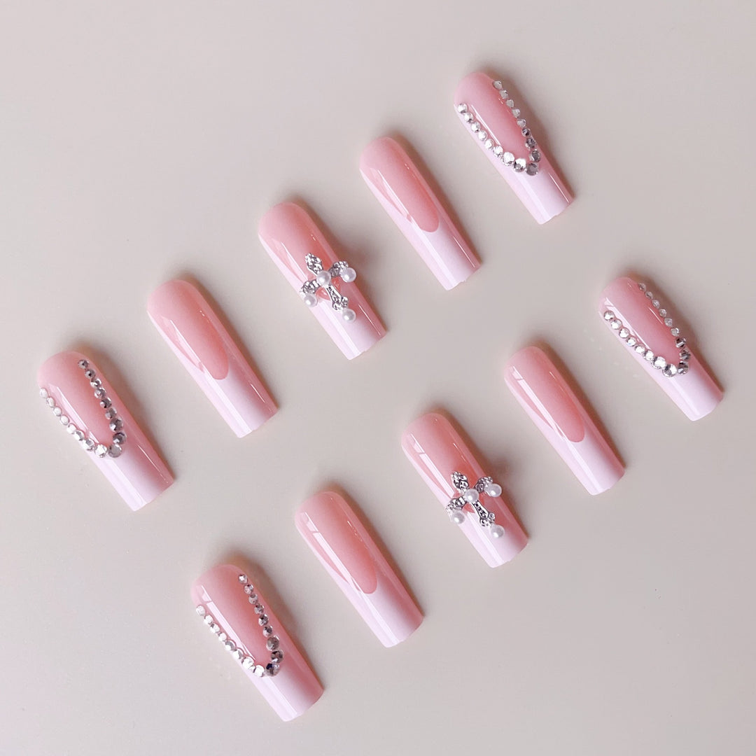Acrylic nail set with glamorous rhinestone decorations and elegant French tips Stornfield