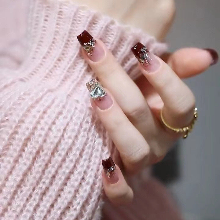 Artificials nails with glitter embellishments and elegant accents Stornfield