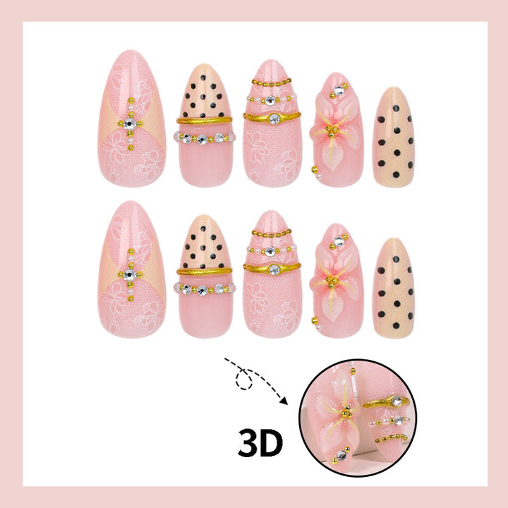 Artificial nail set with delicate floral patterns and elegant accents Stornfield