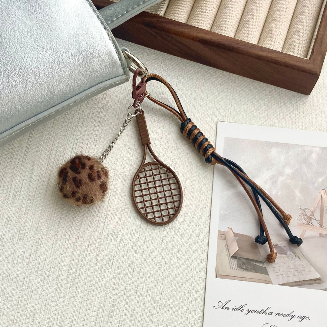 Tennis Racket and Fur Ball Keychain Stornfield