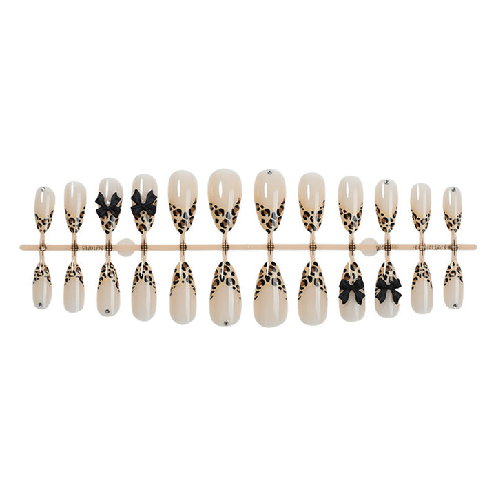 Nail art set with leopard pattern and glitter embellishments Stornfield