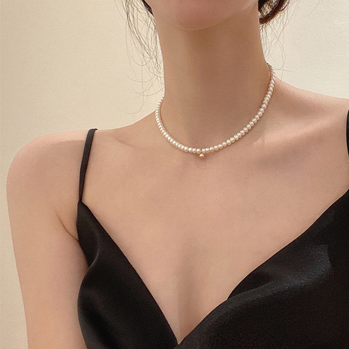 Delicate pearl necklace with elegant gold accent chain Stornfield