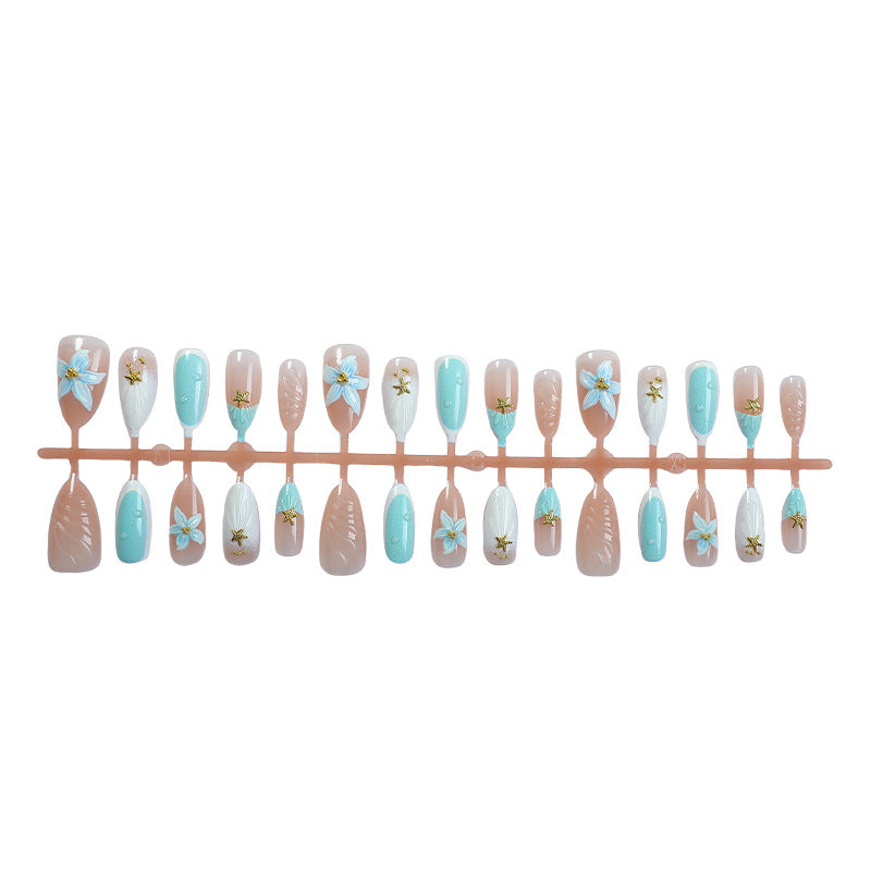 Artificial nail set with floral design and artistic embellishments Stornfield