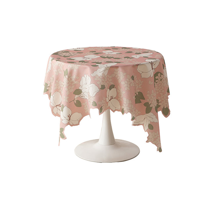 Round wipeable tablecloth with floral cut-out hem Stornfield