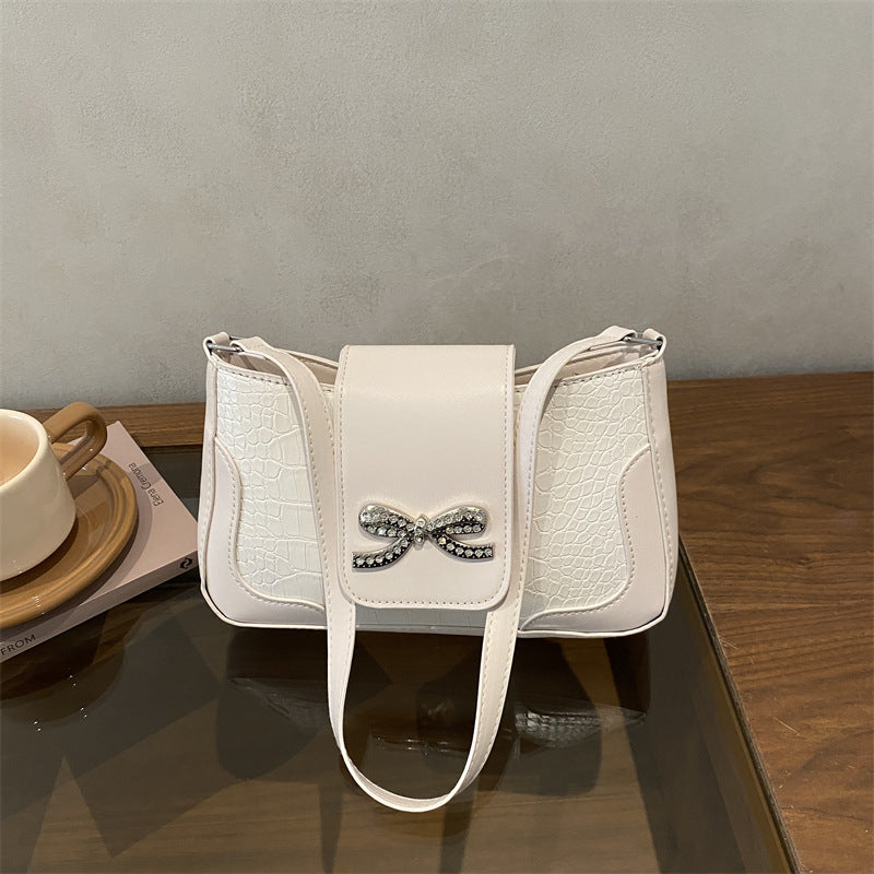 Elegant Crocodile-Patterned Handbag with Bow Detail