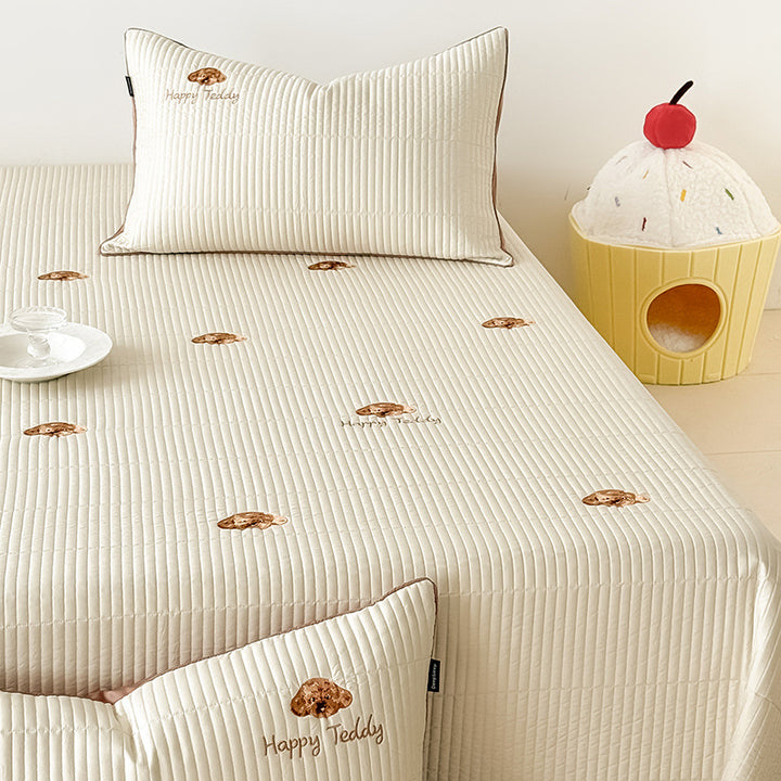 Padded fitted sheet set with vertical quilting and subtle floral embroidery