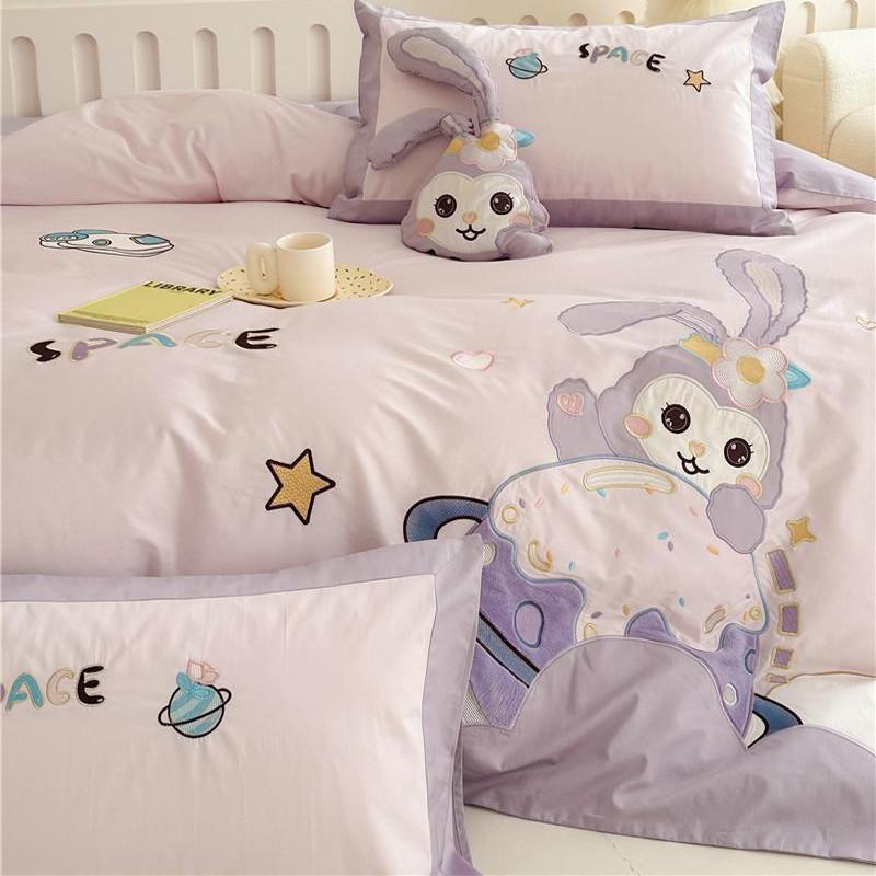 Children's bedding set with playful space bunny design