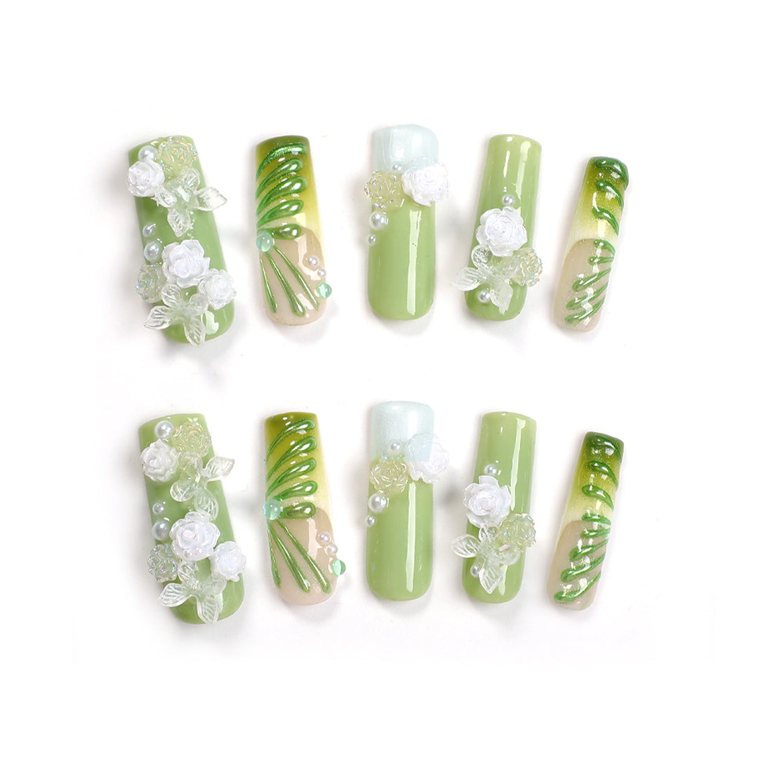 Creative nail set with floral design and delicate accents Stornfield