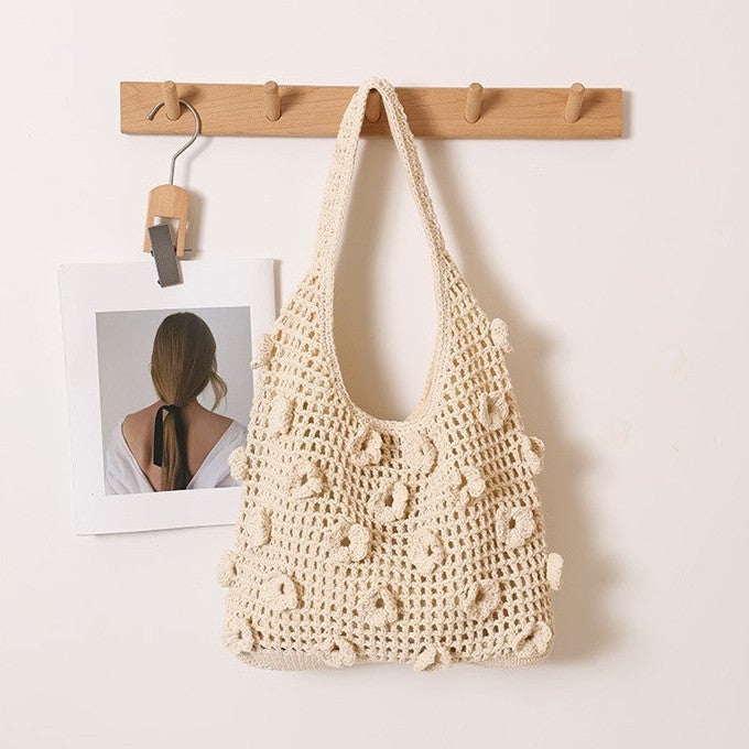 Hand-knotted shoulder bag with floral structural elements Stornfield