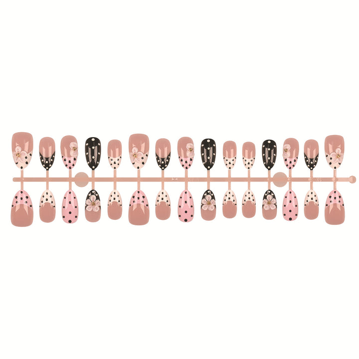 Artistic Press-On Nail Set Featuring Floral and Polka Dot Designs