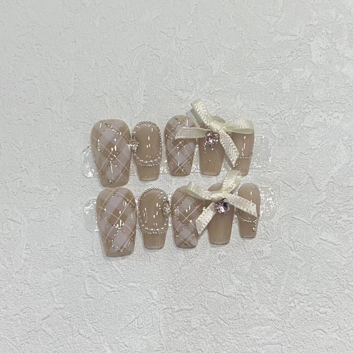 Elegant Press-On Nail Art Set with Ribbons and Gemstone Accents Stornfield