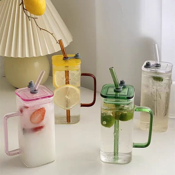 Women's drinking container with innovative lid system and integrated straw Stornfield