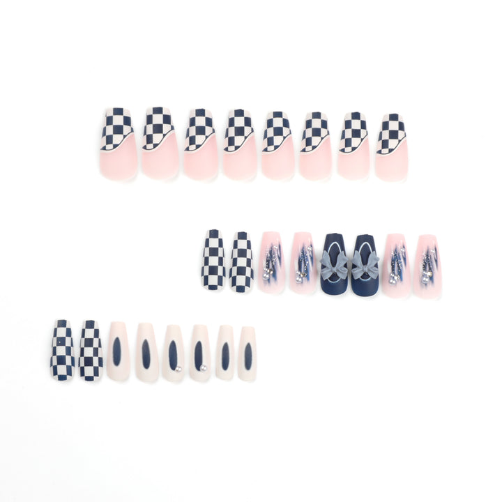 Artful nail decoration with bows and plaid pattern Stornfield