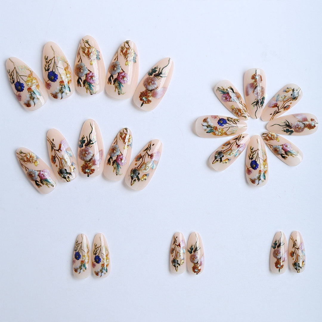 Artificial nails with floral designs and gold accents Stornfield