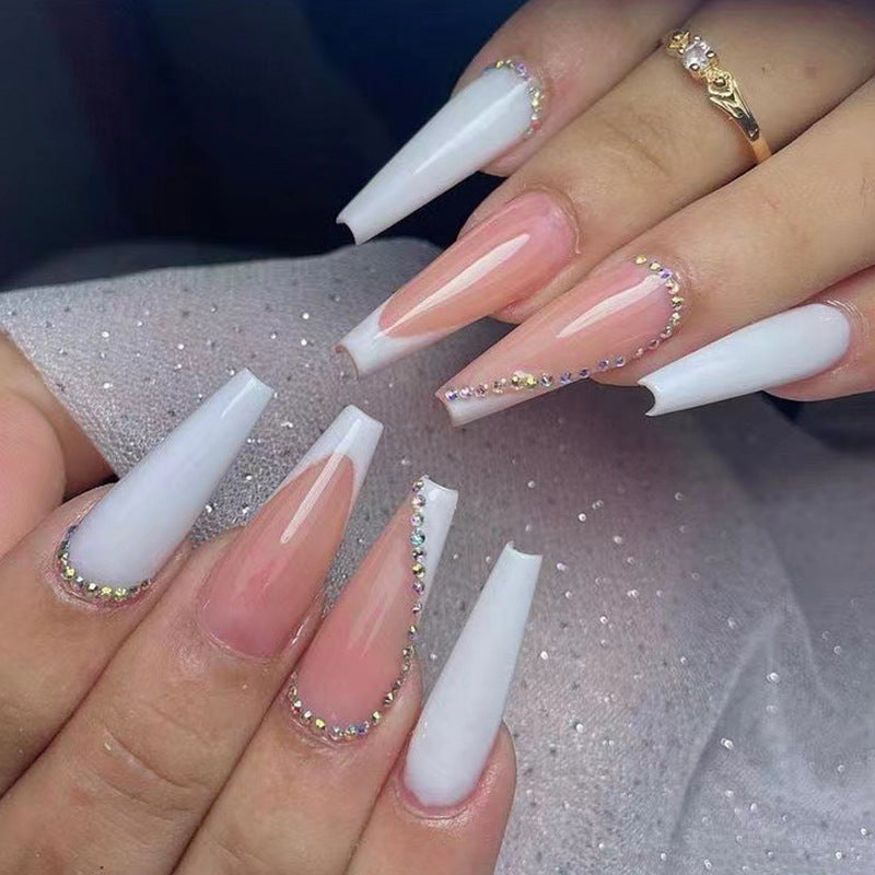 Artful nail extensions with rhinestone embellished accents Stornfield