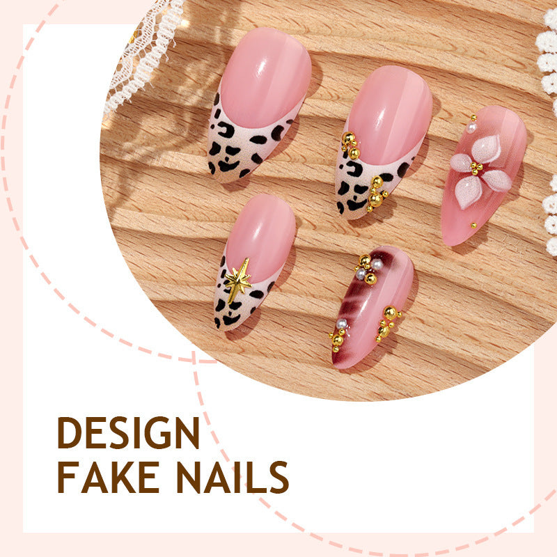 Acrylic nail set with glamorous accents and floral decorations Stornfield