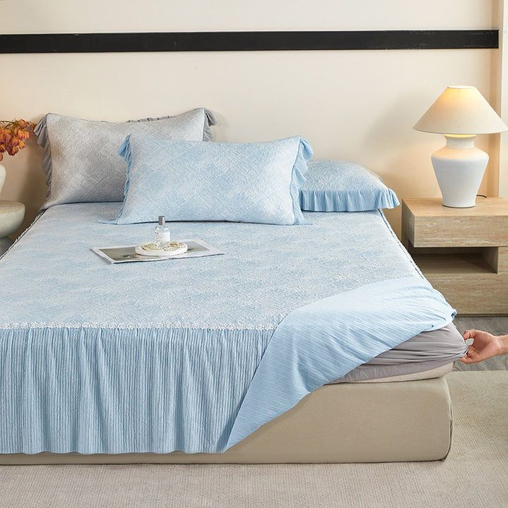 Reversible mattress protector with pleated ruffle and microfiber velvet surface