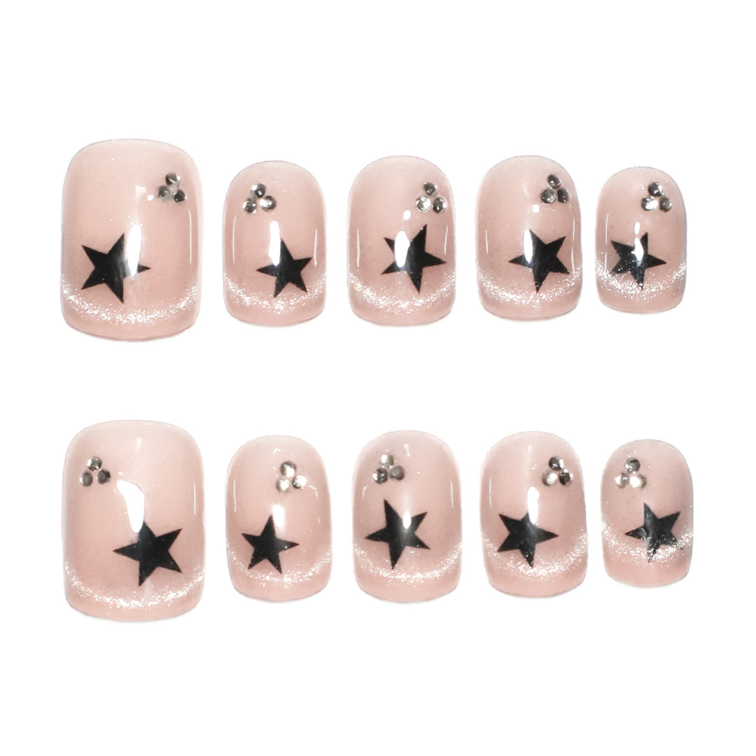 Artistic acrylic nails with glamorous star motifs Stornfield