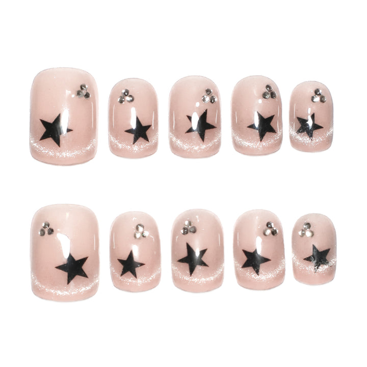 Artistic acrylic nails with glamorous star motifs Stornfield