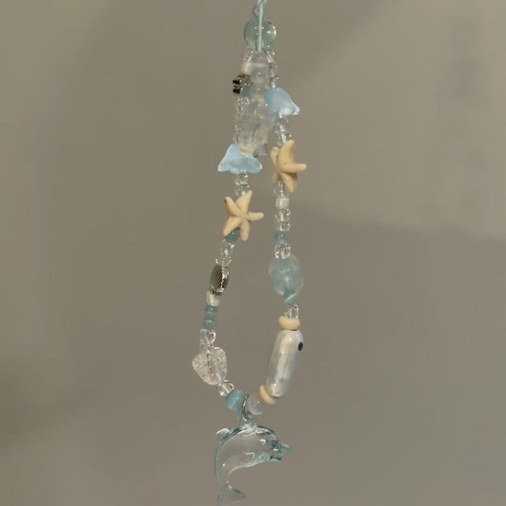 Dolphin-Themed Beaded Charm Eyewear Holder Stornfield