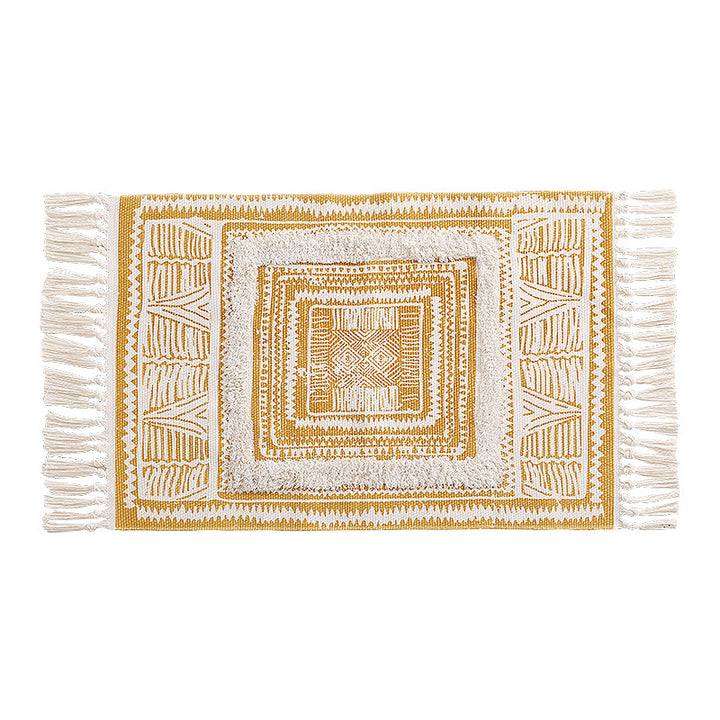 Flat Boho runner rug made of cotton blend fabric with geometric hexagon tufting and decorative fringed edge.