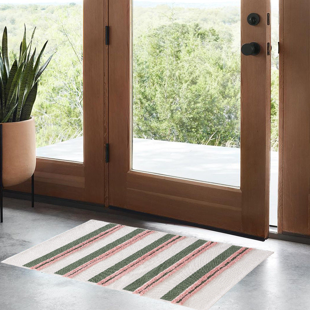 Cotton bath mat with textured stripes and fringes Stornfield