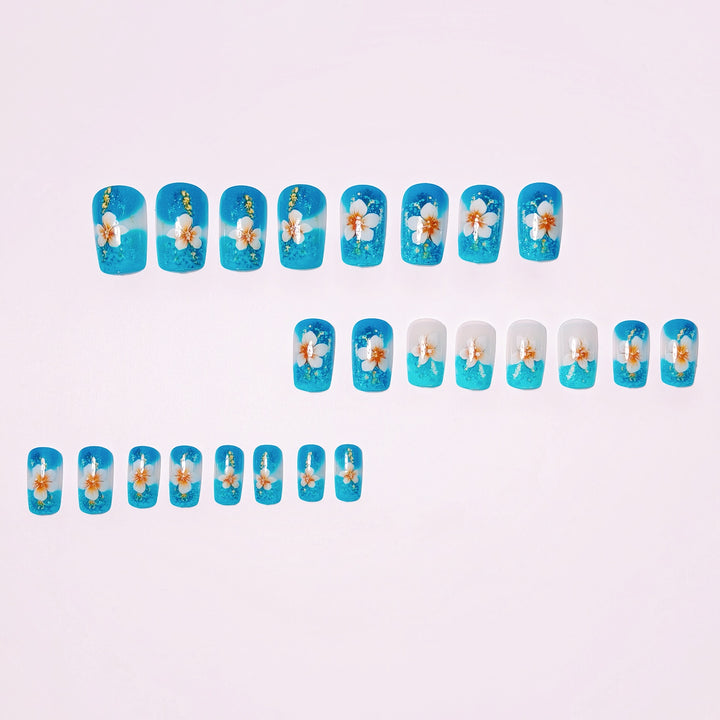 Artificial nails with floral accents and glitter patterns Stornfield