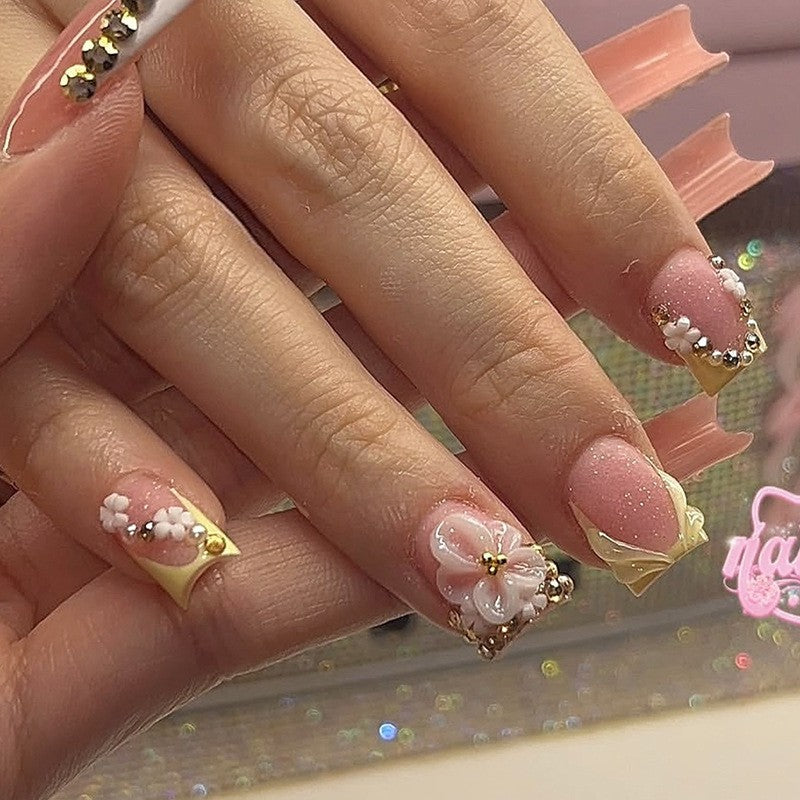 Artificial nail set with floral design and glamorous embellishments Stornfield