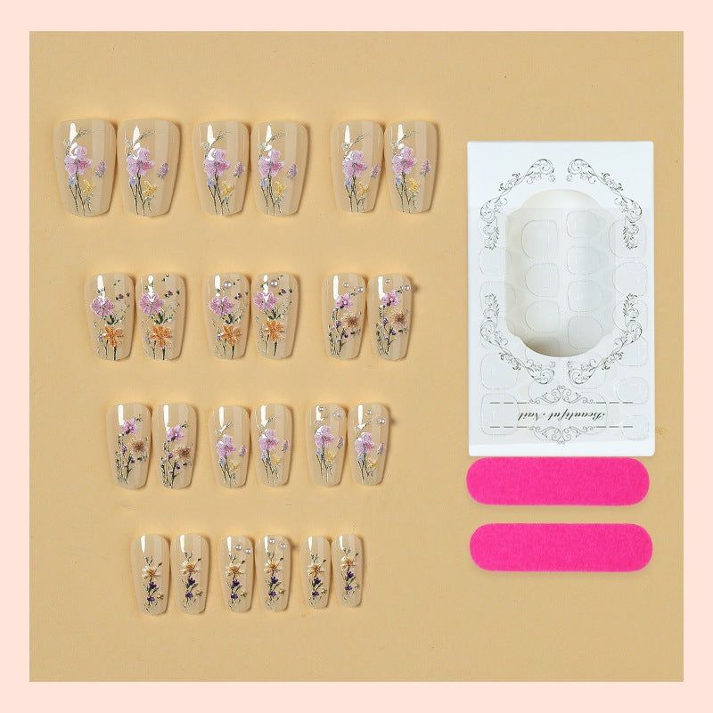 Artificial nail set with floral embellishments and glamorous details Stornfield