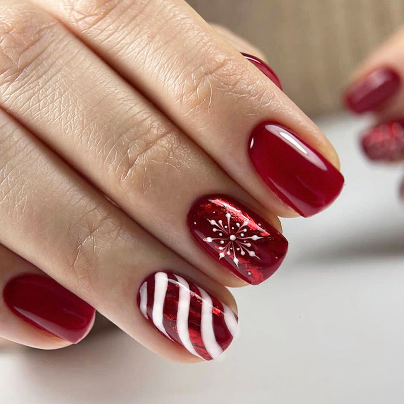 Artificial nail set with festive designs and glitter accents Stornfield