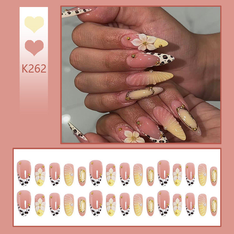 Artificial nails with floral patterns and golden accents Stornfield